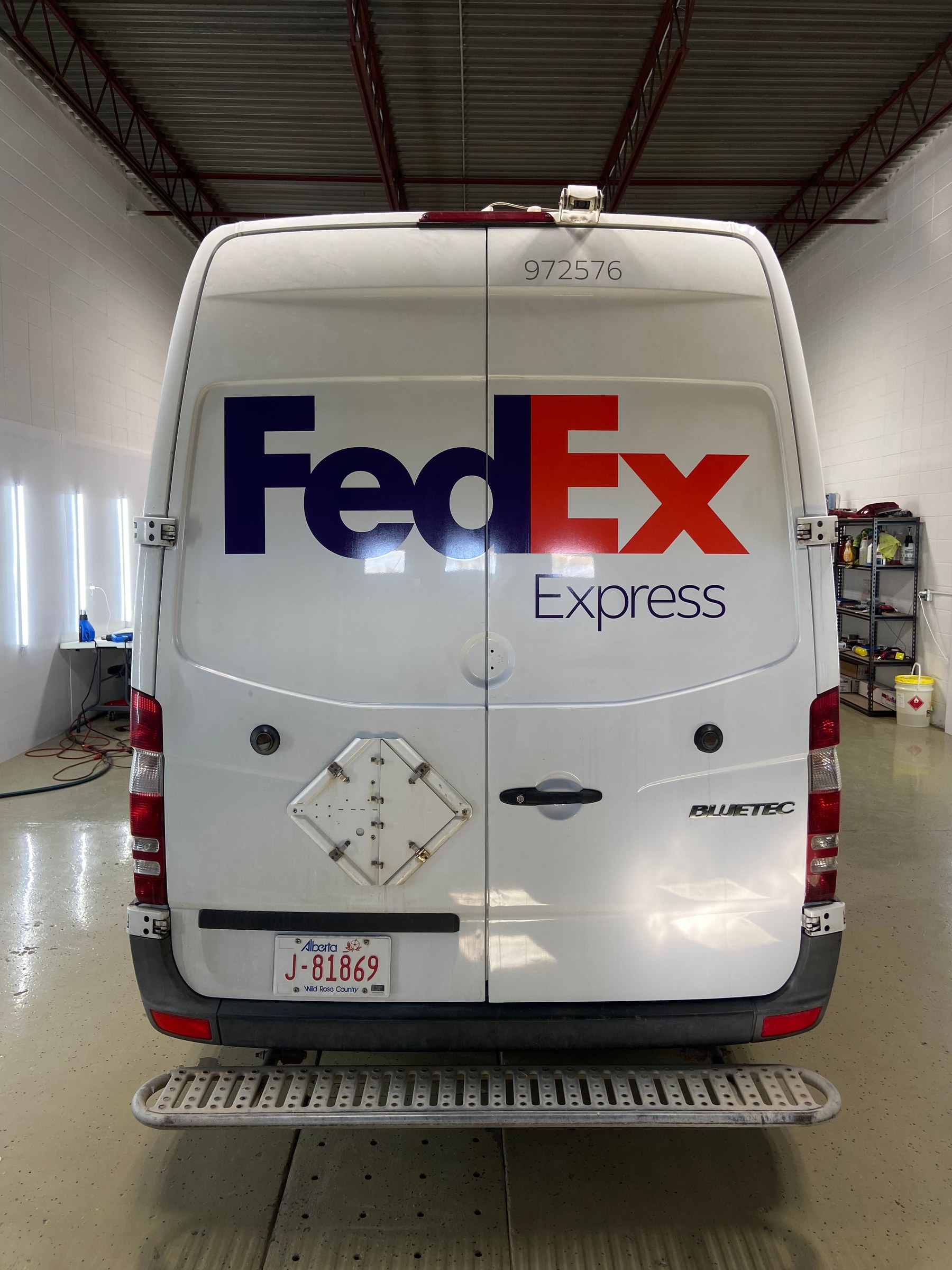Rear view of a FedEx Express Mercedes Sprinter delivery van carrying full FedEx livery
